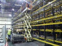 warehouse pallet racking installation team dismantling